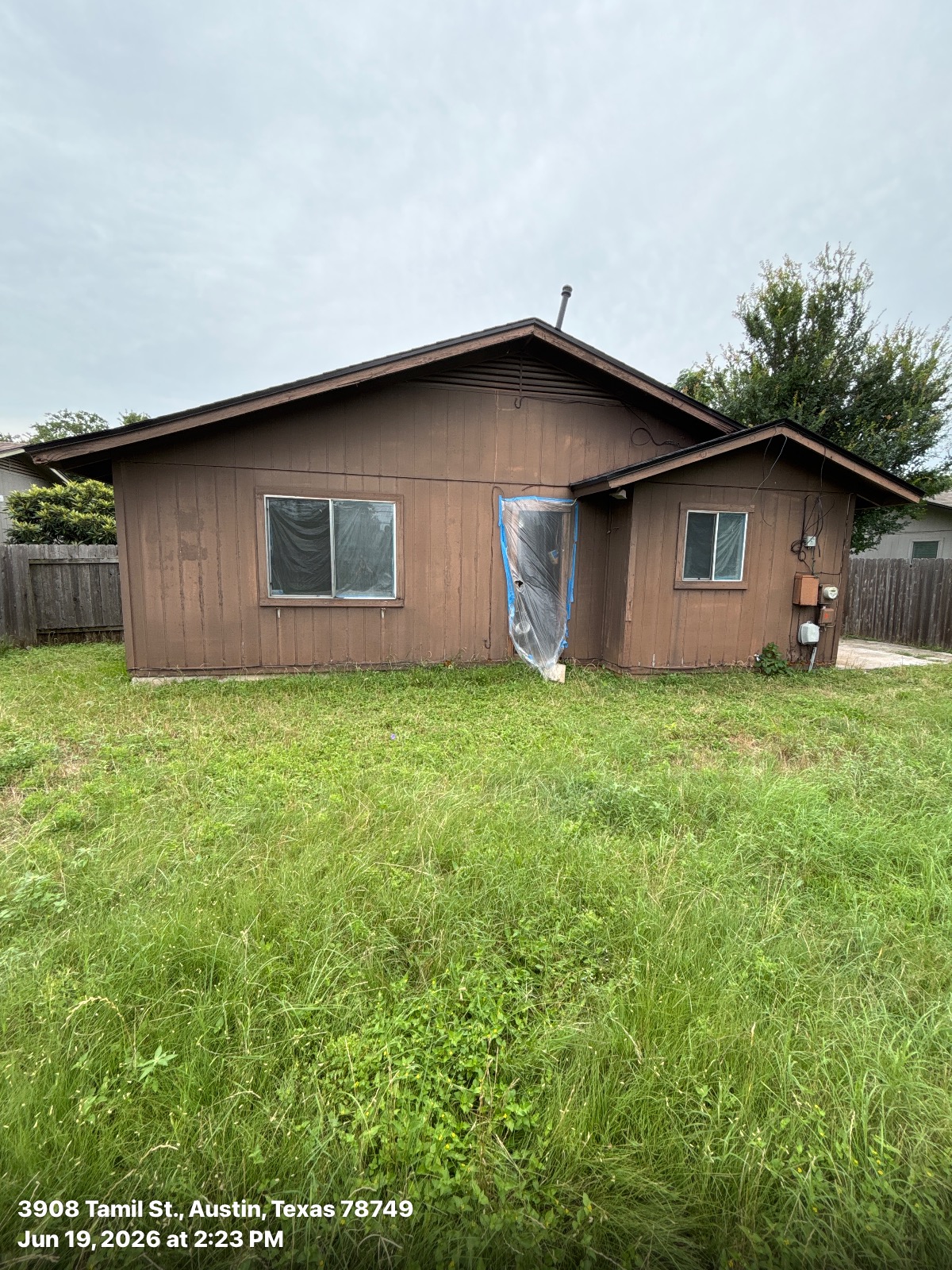 Austin home before James Hardie siding replacement