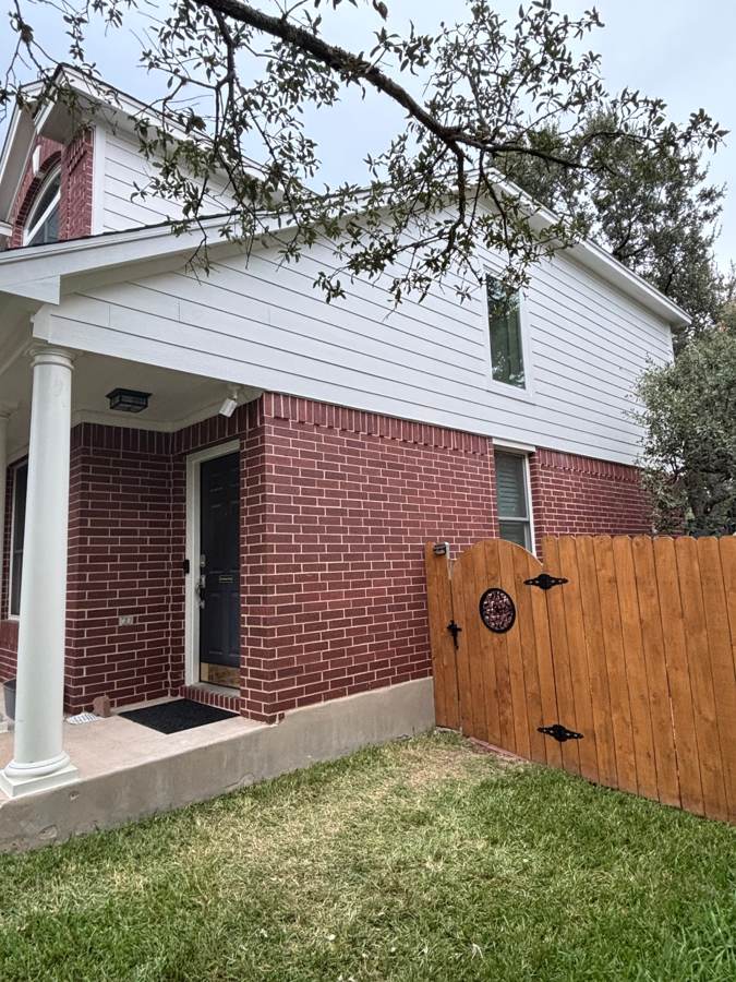 New horizontal lap siding above the same porch