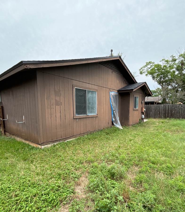 Weathered brown panel siding